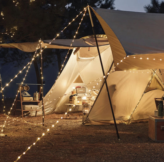 USB-powered 50 LED campsite string lights glowing warm white at a camp table