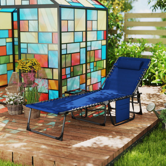 Outdoor lounge chair reclined flat with fold-out side table in dark blue