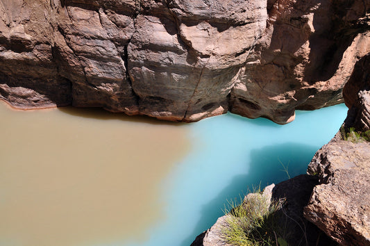 Turquoise mineral-rich water of Havasu Creek flowing through red rock in the Grand Canyon, Arizona. Grand Canyon National Park photo.