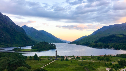 Misty loch and green hills in the Scottish Highlands