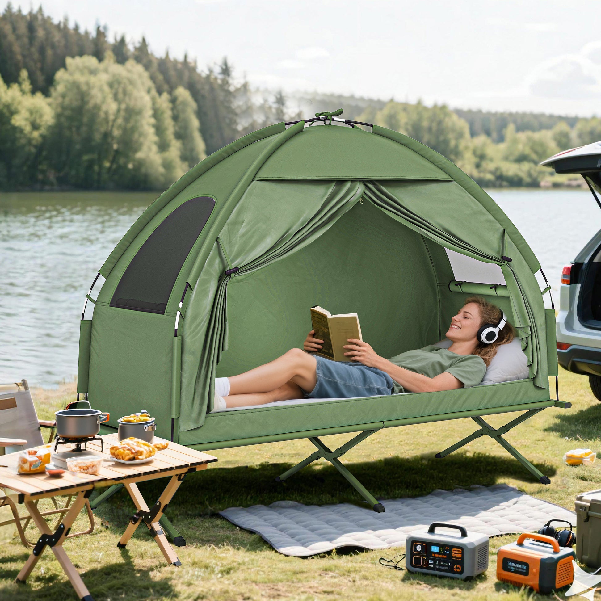 Elevated camping cot with covered canopy pitched beside a tent